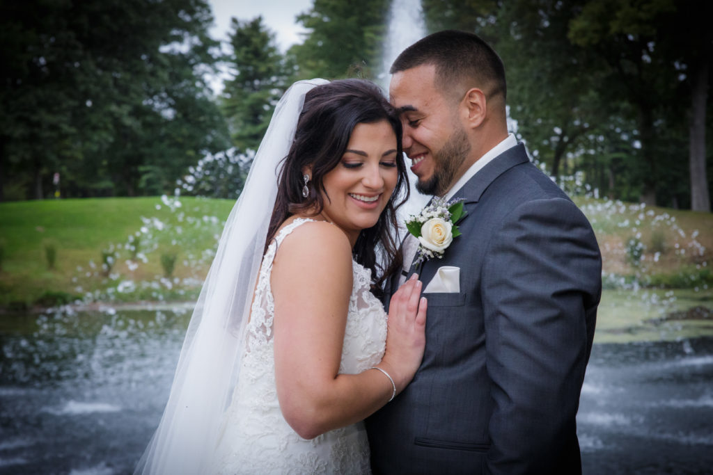 Bride and groom in front of water fountain - White Mountains Wedding Photography
