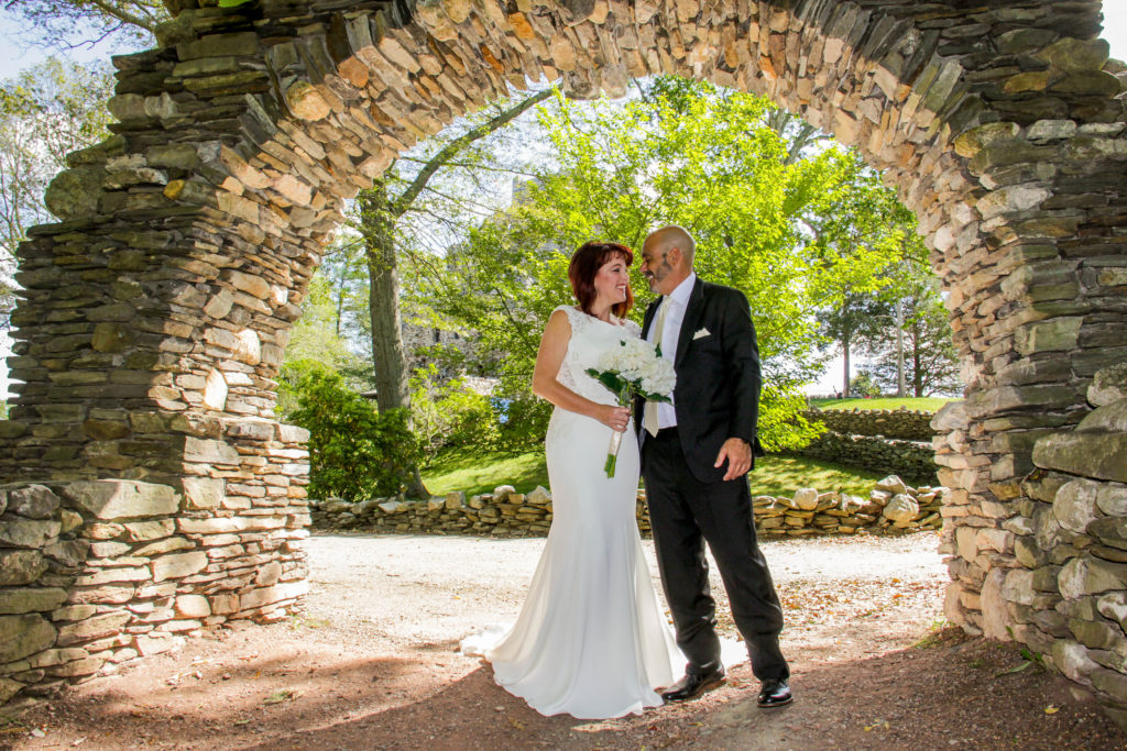 Wedding couple under rock arch - White Mountains Wedding Photography