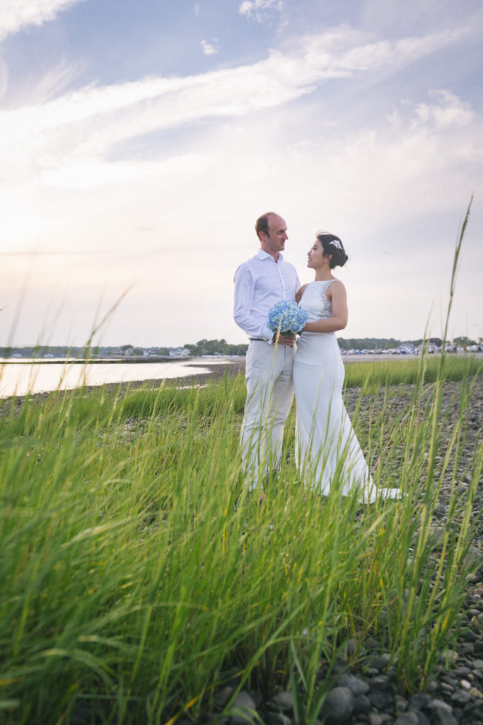 Wedding couple standing with green grass - White Mountains Wedding Photography