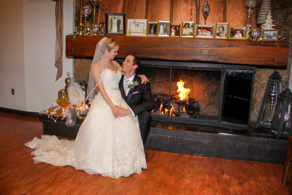 Couple in front of fireplace - White Mountains Wedding Photography