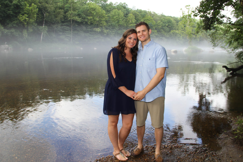 Couple standing near water for engagement sitting - White Mountains Wedding Photography