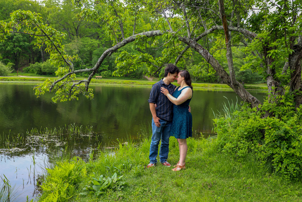 Geck engagement - by the water under the tree arch